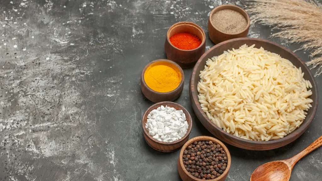 Bowl of Rice surounded by spices